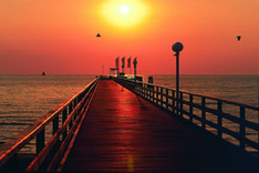 Sunrise above the pier (Photo: Tourismus-Service Scharbeutz)