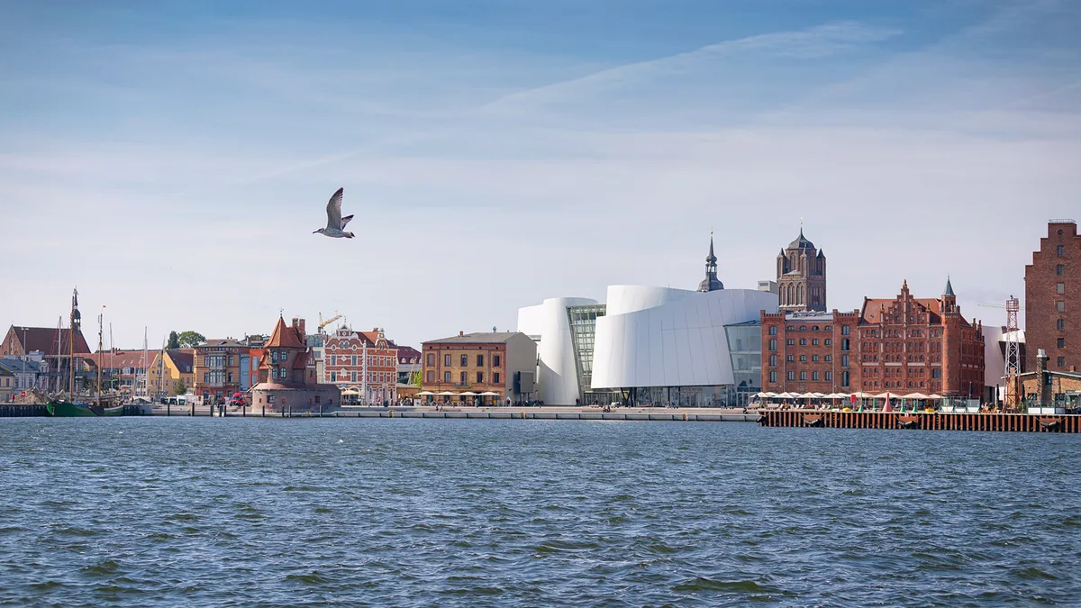 OZEANEUM on the Stralsund harbourfront, with the old town, water and a seagull